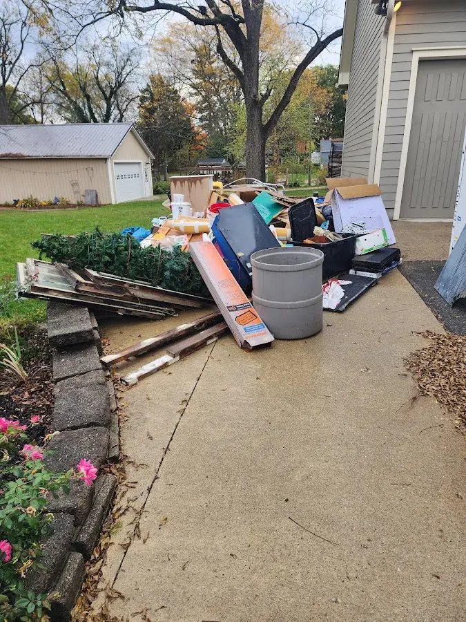 Dumpster being loaded with debris for 3 Yard Dumpster Rental in Southborough